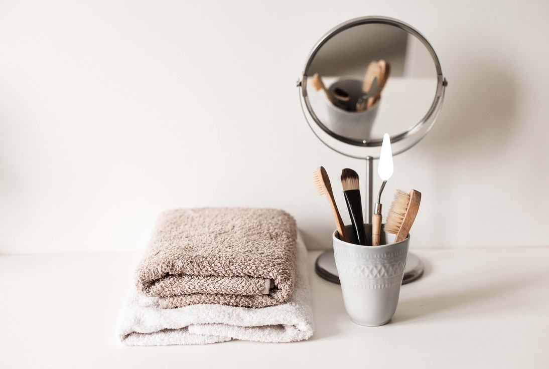 Towels and Skincare Brushes on a Table